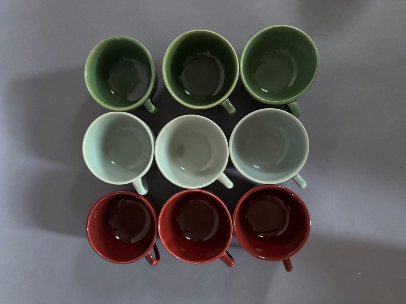 Nine Vintage MCM Bauer Tea Cups – deep red, light blue, and dark green