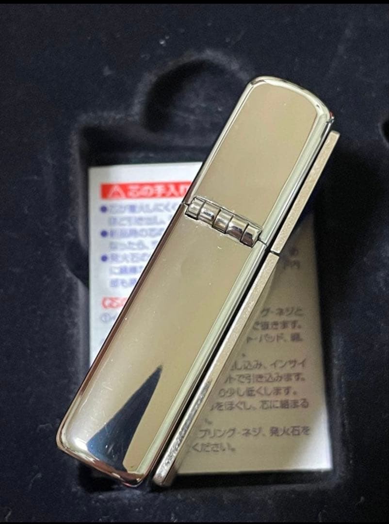 Zippo Stars and Stripes Metal Paste Made in 2003 with can case, oil, and flint,
