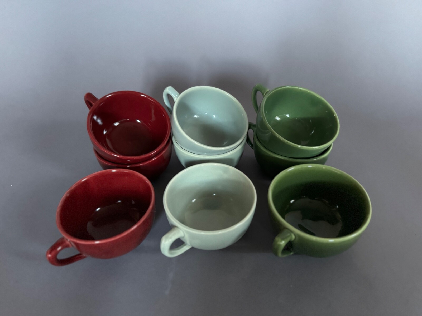 Nine Vintage MCM Bauer Tea Cups – deep red, light blue, and dark green
