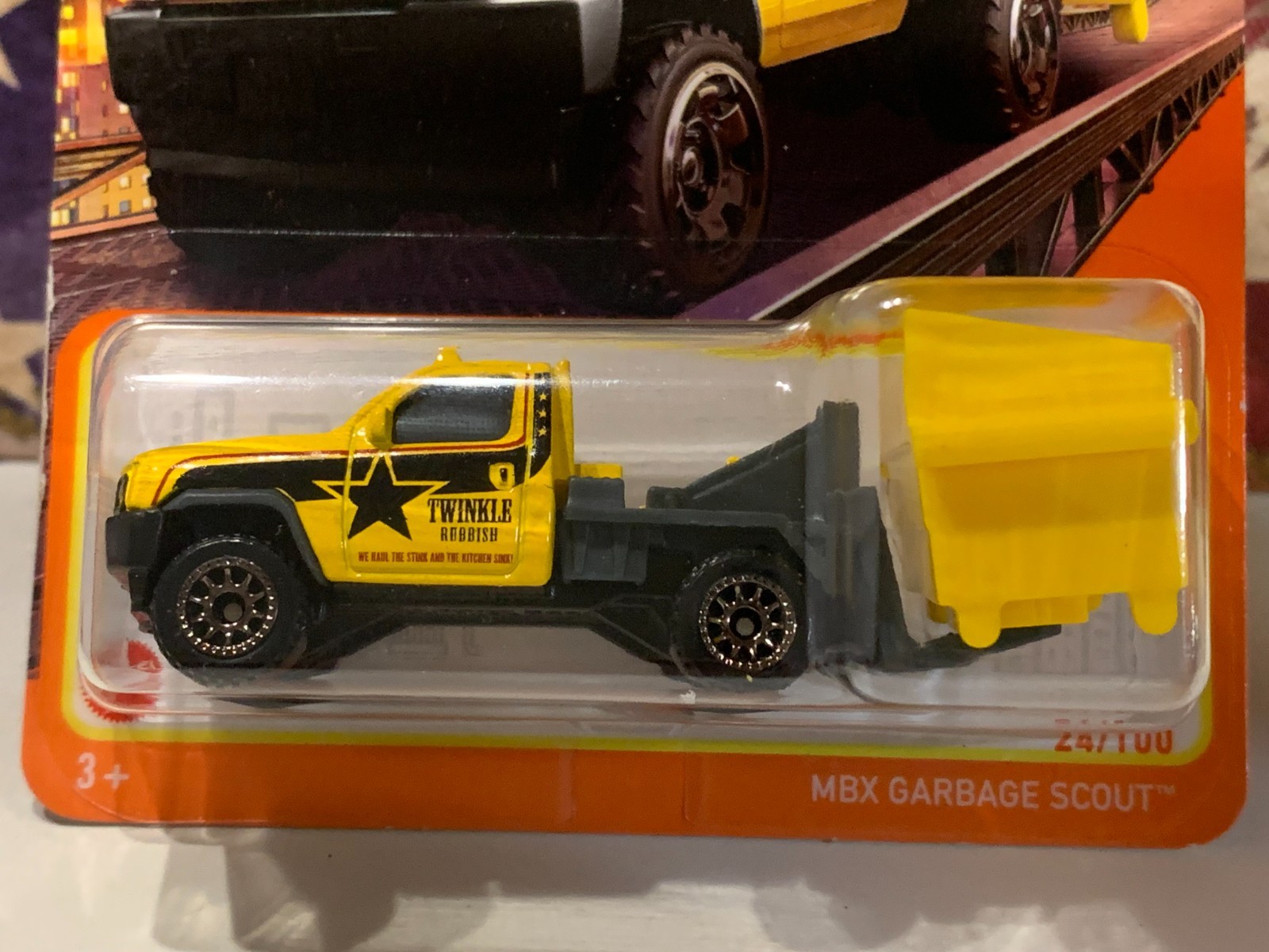 MATCHBOX MBX GARBAGE SCOUT WITH DUMPSTER. YELLOW/BLACK ON CARD
