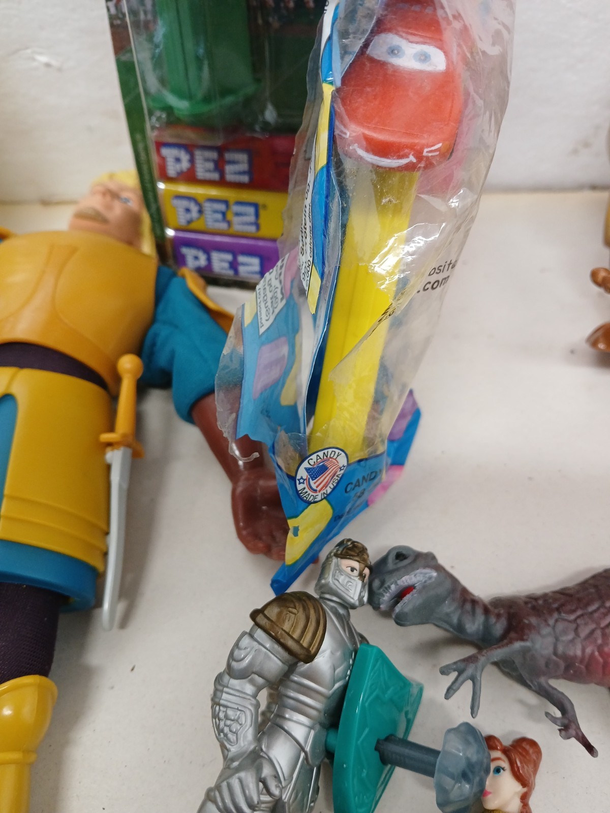 Vintage Toy Junk Drawer Lot PEZ Disney Cars Eeyore Figures Marbles Airplane