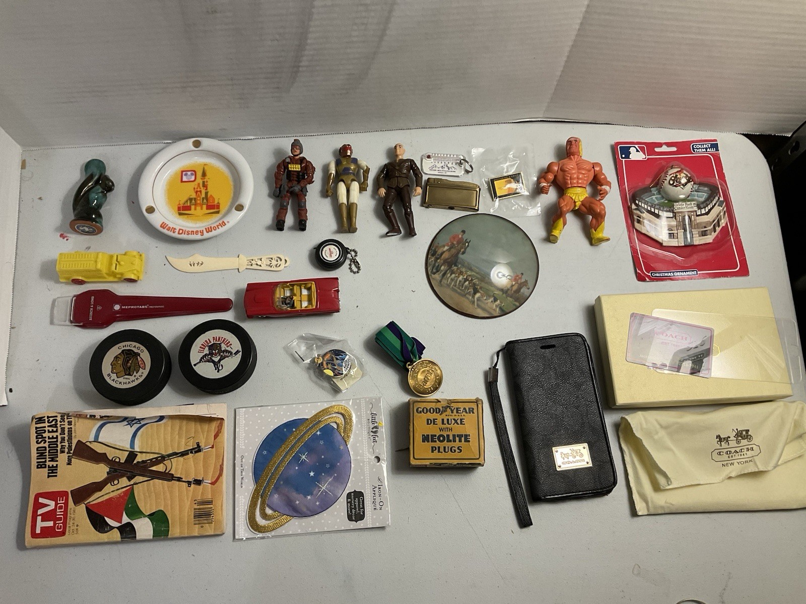 Vintage large junk drawer Lot NHL hockey pucks action figures Corgi Car Misc.
