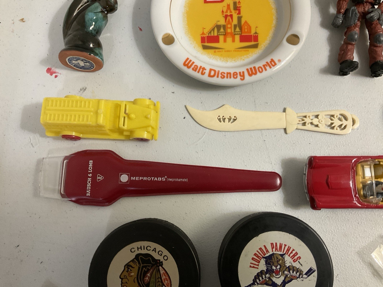Vintage large junk drawer Lot NHL hockey pucks action figures Corgi Car Misc.