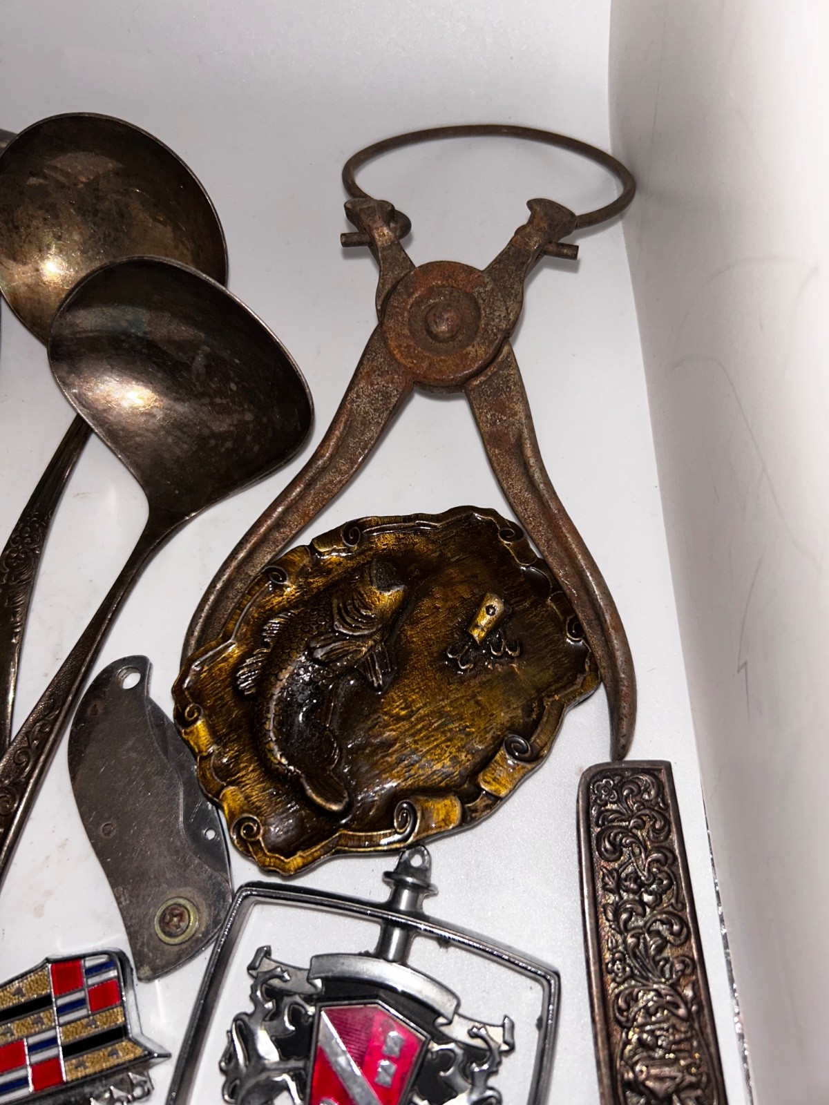 Junk Drawer For Men With Some Old Tools, Belt Buckles, Auto Insignia and More