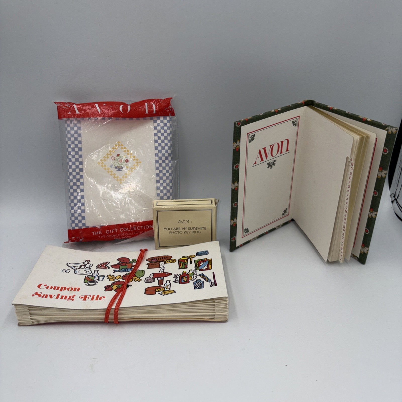 A Variety Of Avon & Chadwick-Miller Items File Book, Photo Key Ring, Coupon File