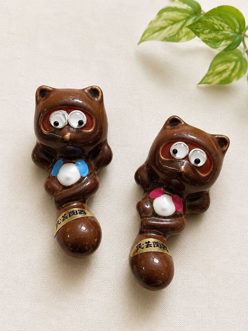 Folk art pottery raccoon chopstick rest set of 2