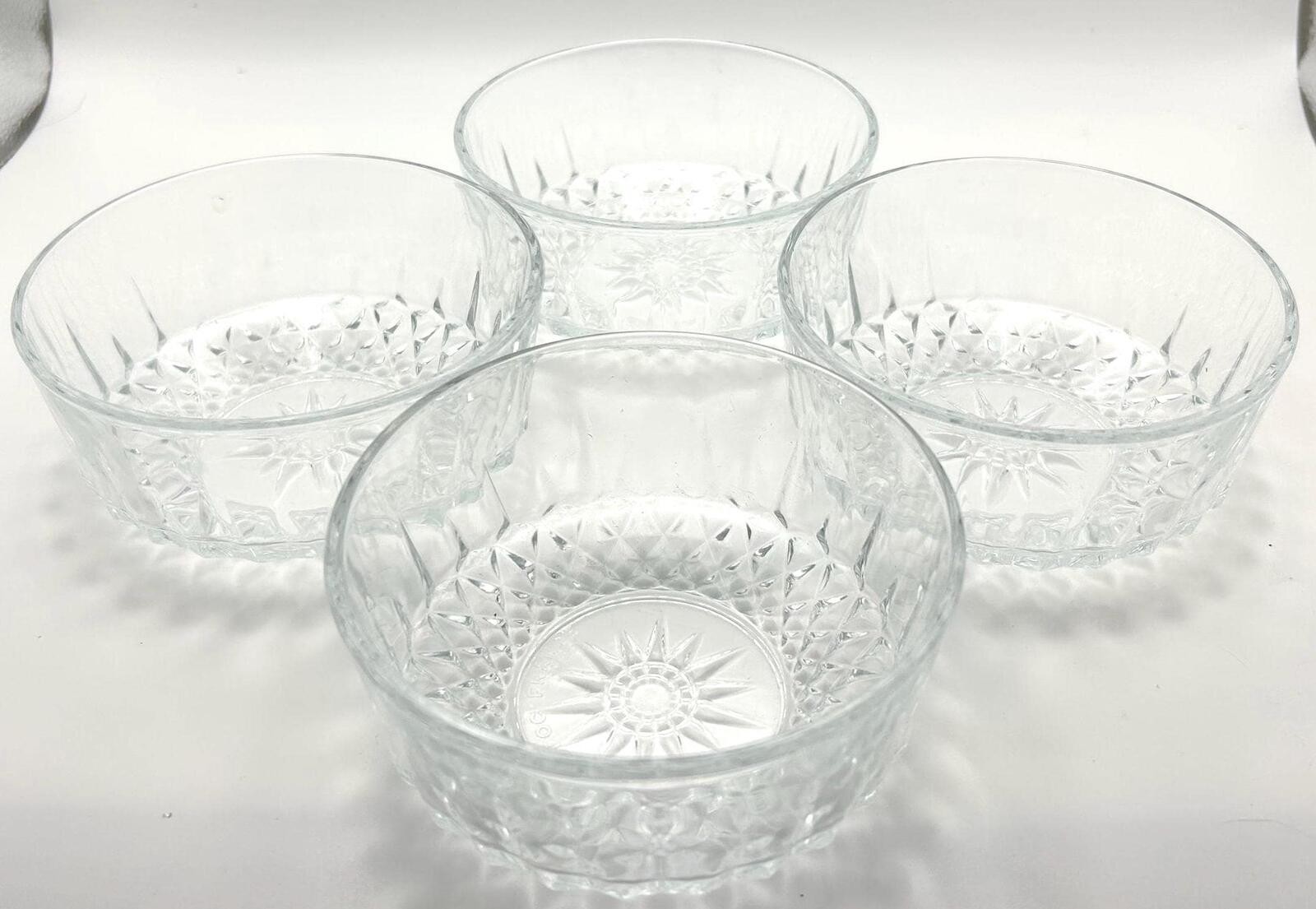 Arcoroc France Clear Glass Starburst Serving Bowl and Four Matching Salad Bowls.