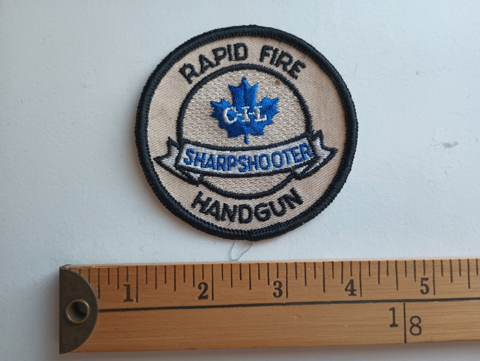 * 80s CIL CANADIAN INDUSTRY AMMUNITION HANDGUN GUN SHARPSHOOTER PATCH CREST *