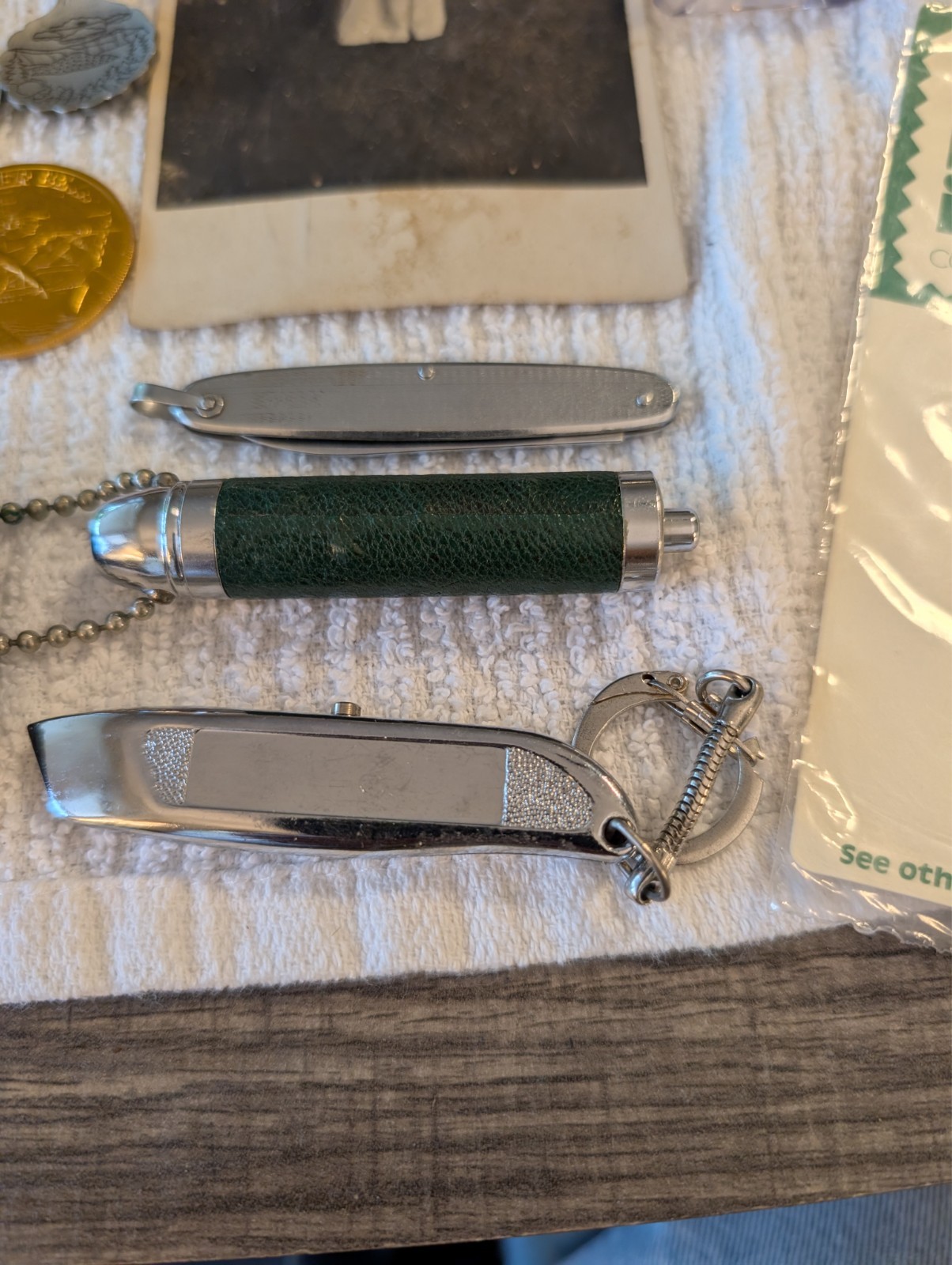 vintage mixed lot knives tokens coke cars cabinet photo records bottles